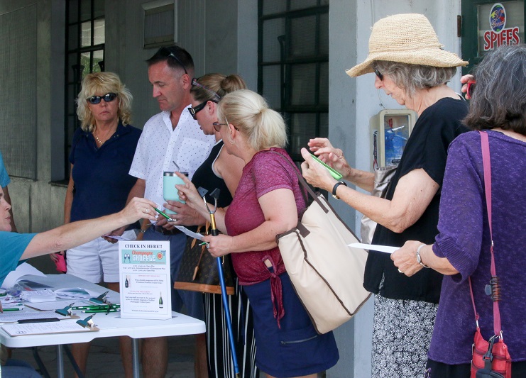 An image of volunteers passing out tickets at an event